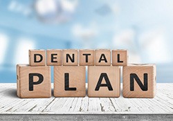 Blocks spell “dental plan”