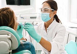 Emergency dentist in Fort Worth performing dental exam
