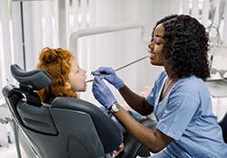 Emergency dentist in Fort Worth performing a dental exam