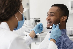 young man smiling at his sedation dentist in Fort Worth