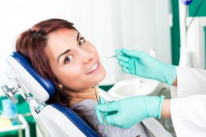 Woman smiling in dentist’s chair