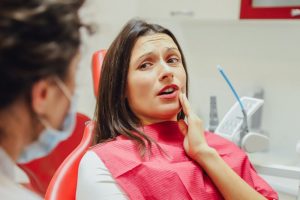 Woman with toothache at dentist in Hulen