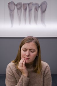 Woman with toothache at dentist