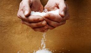 Hands holding salt