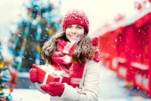 Smiling woman enjoying holiday festivities 