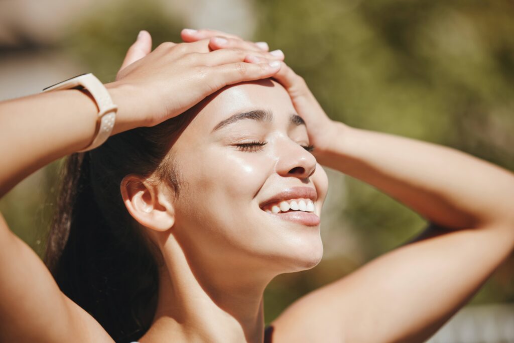 Closeup of smiling woman spending time in the sun