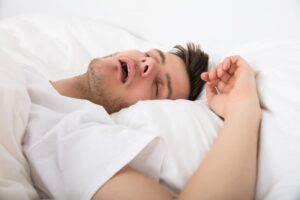 Man with sleep apnea snoring