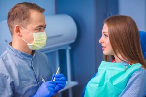 dentist talking to a female patient